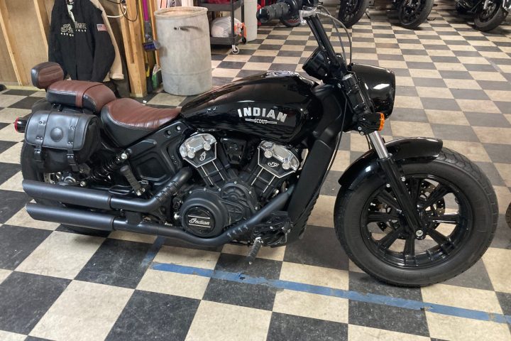 a motorcycle parked on the side of a road